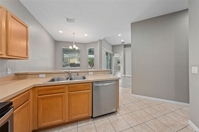 kitchen featuring sink, dishwasher, range, hanging light fixtures, and a notable chandelier