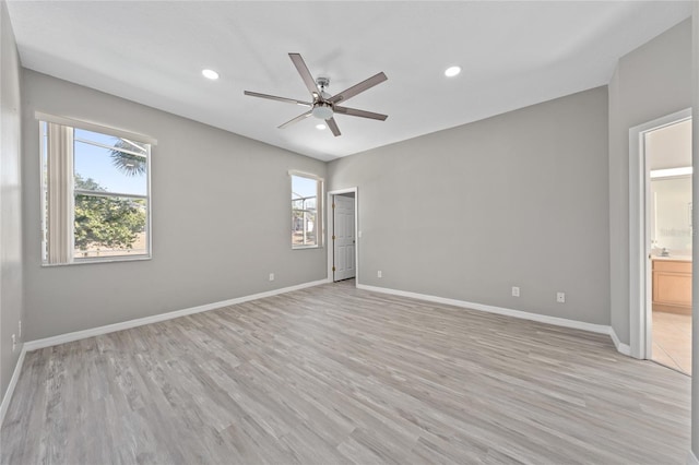 unfurnished room featuring ceiling fan, plenty of natural light, and light hardwood / wood-style floors