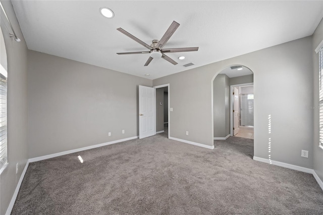 unfurnished bedroom featuring connected bathroom and carpet floors