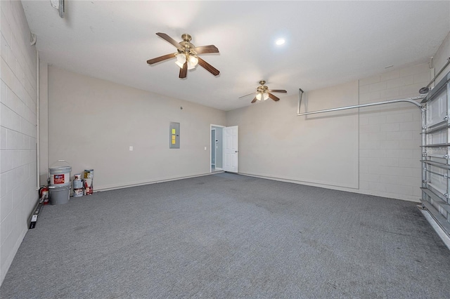 garage with electric panel and ceiling fan