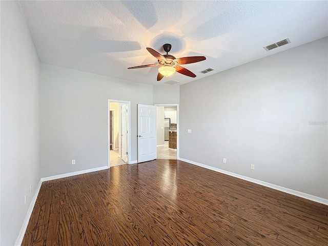 interior space with ceiling fan, hardwood / wood-style floors, and a textured ceiling