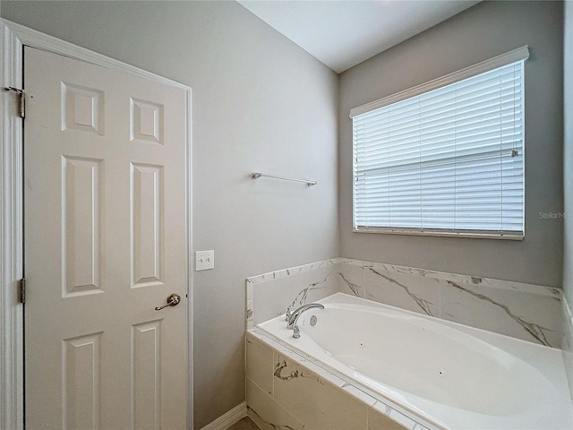 bathroom with tiled bath