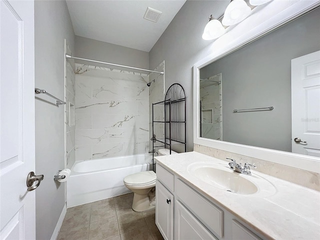 full bathroom featuring tiled shower / bath, vanity, toilet, and tile patterned flooring