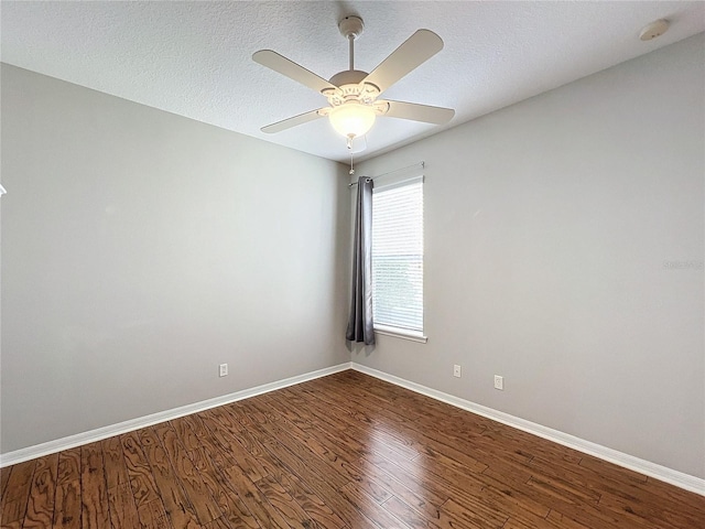 spare room featuring ceiling fan, wood-type flooring, and a textured ceiling