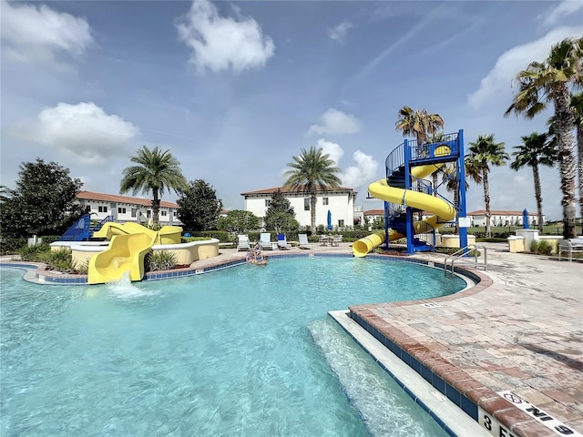 view of pool with a water slide