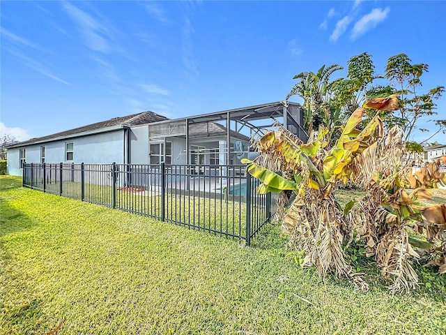 1404 Lexington Ave, Davenport, FL 33837 - rear view of property with a fenced in pool, fence, a patio, a lawn, and a lanai