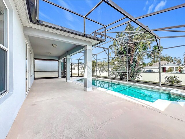 1404 Lexington Ave, Davenport, FL 33837 - view of swimming pool with glass enclosure, a fenced in pool, and a patio