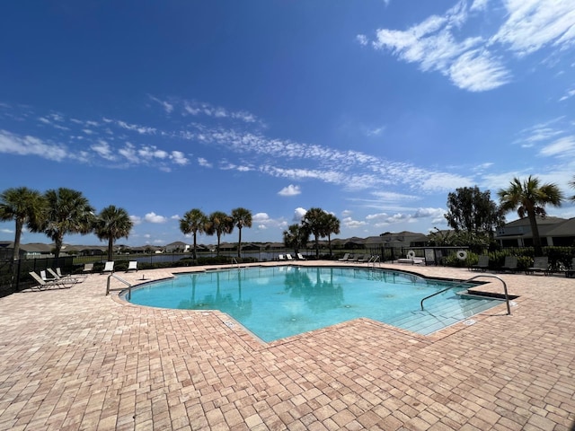 view of swimming pool with a patio area