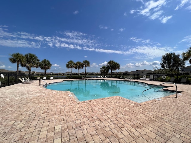 view of pool featuring a patio area