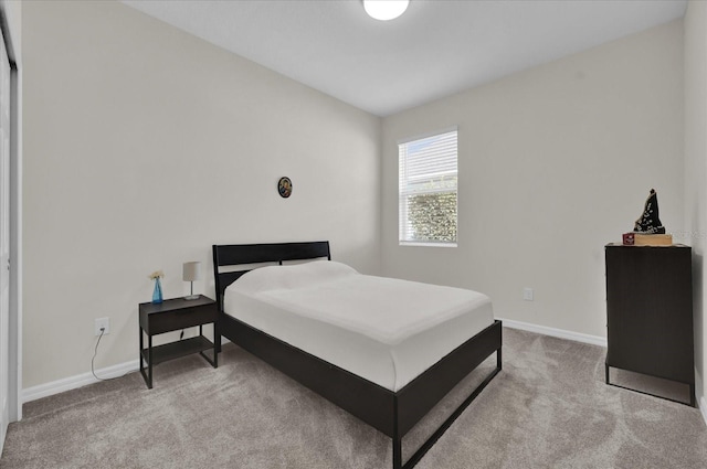 bedroom with light colored carpet