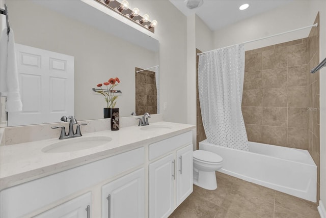 full bathroom with shower / bath combo, vanity, tile patterned floors, and toilet