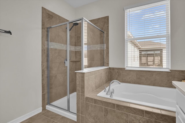 bathroom featuring independent shower and bath and tile patterned flooring