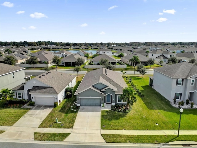 birds eye view of property with a residential view