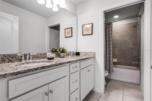 full bathroom with vanity, shower / bathtub combination with curtain, tile patterned floors, and toilet