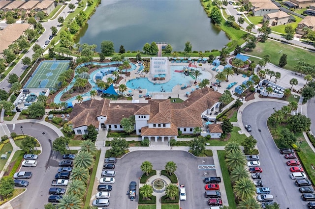 birds eye view of property with a water view