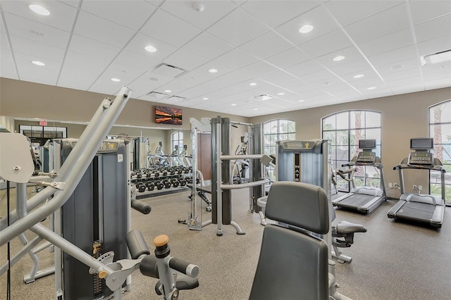 exercise room featuring a paneled ceiling