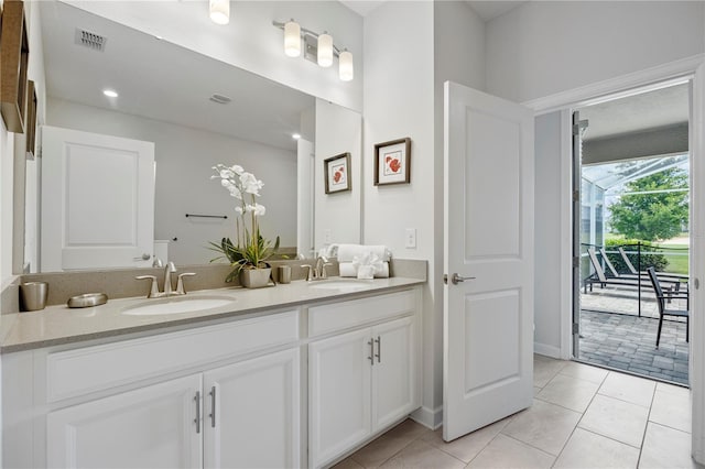 bathroom with vanity and tile patterned flooring