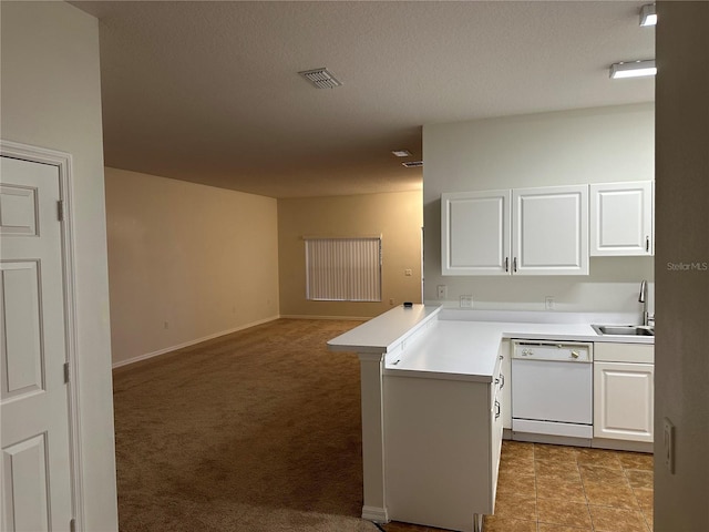 kitchen with white cabinetry, sink, kitchen peninsula, and dishwasher