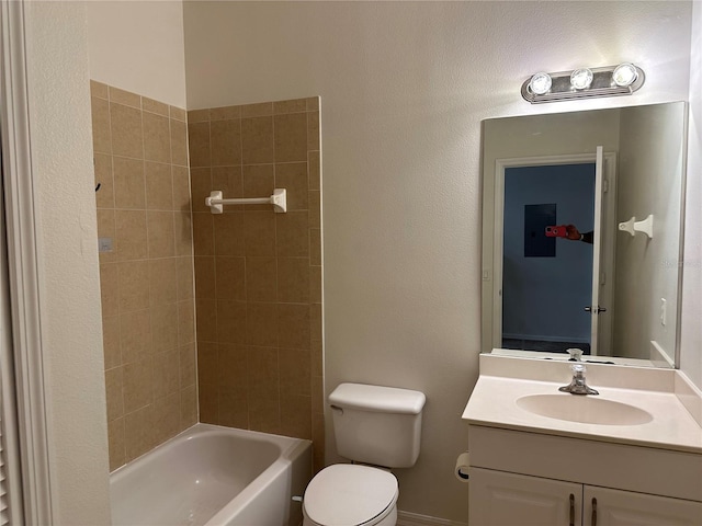 full bathroom featuring vanity, tiled shower / bath, electric panel, and toilet