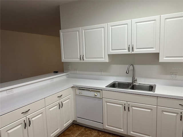 kitchen featuring white cabinetry, white dishwasher, kitchen peninsula, and sink