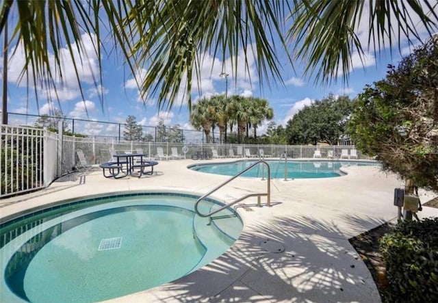 view of swimming pool with a patio