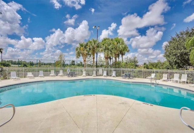 view of swimming pool with a patio area