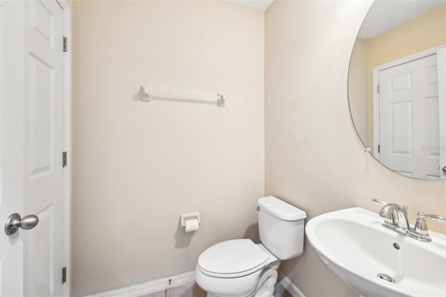 bathroom with sink and toilet