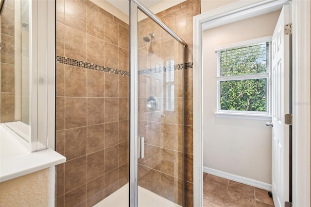 bathroom featuring tile patterned floors and a shower with door