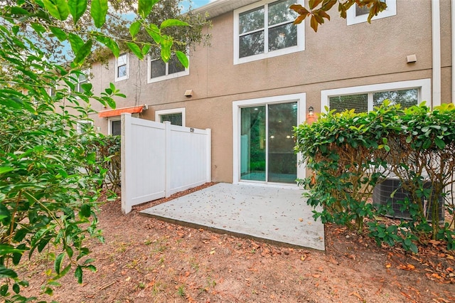 back of property with a patio area