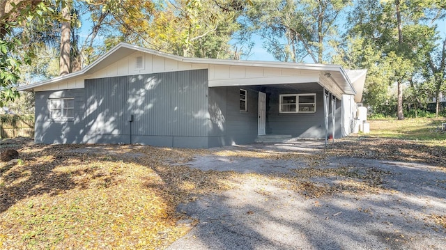 view of side of property with a carport