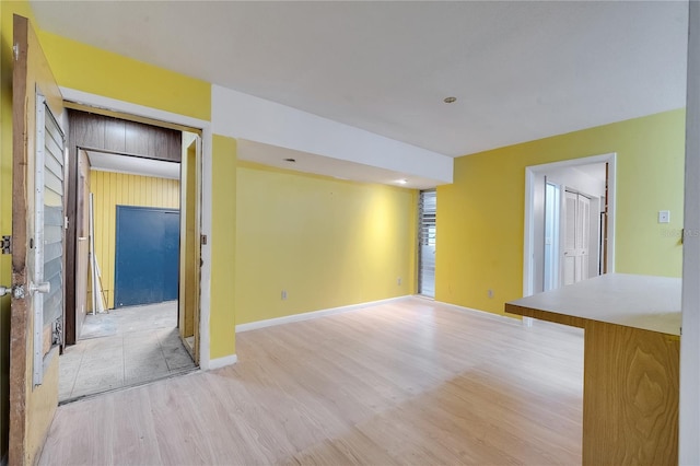 unfurnished room with light wood-type flooring