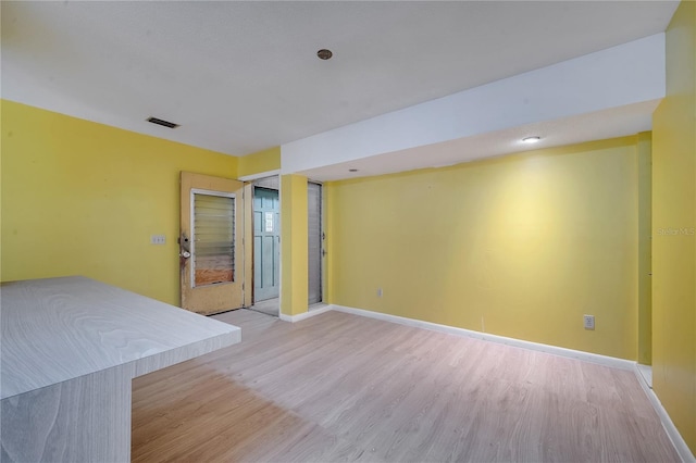 unfurnished bedroom with light wood-type flooring