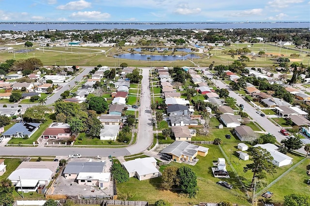 drone / aerial view with a water view