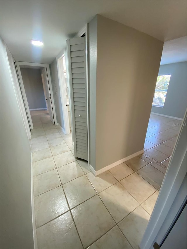 hallway with light tile patterned floors