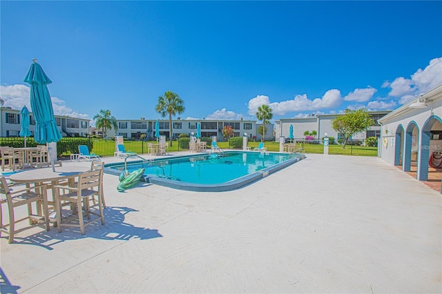 view of pool featuring a patio area