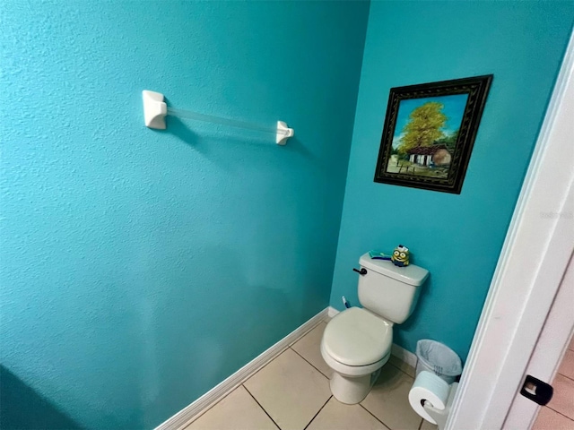 bathroom with tile patterned floors and toilet