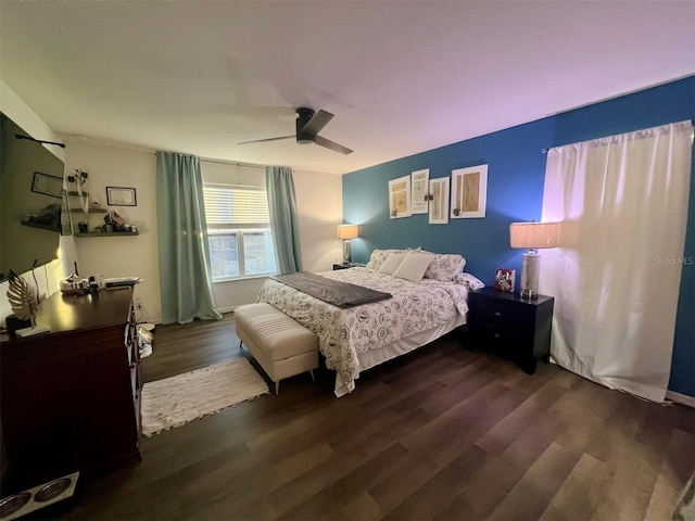 bedroom with dark wood-type flooring and ceiling fan