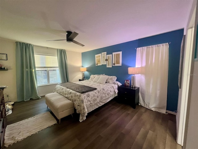 bedroom with dark wood-type flooring and ceiling fan