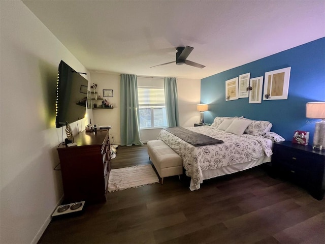 bedroom with dark wood-type flooring and ceiling fan