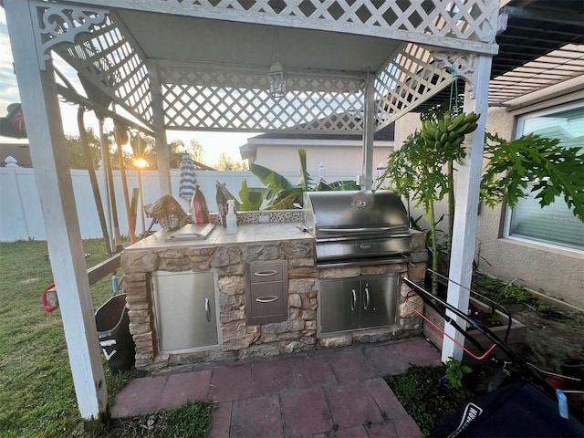 view of patio / terrace with an outdoor kitchen and area for grilling