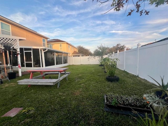 view of yard featuring a sunroom