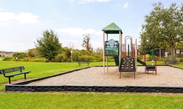 view of jungle gym with a lawn