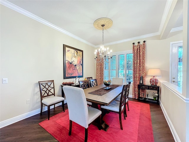 dining room with ornamental molding, dark hardwood / wood-style floors, and a chandelier