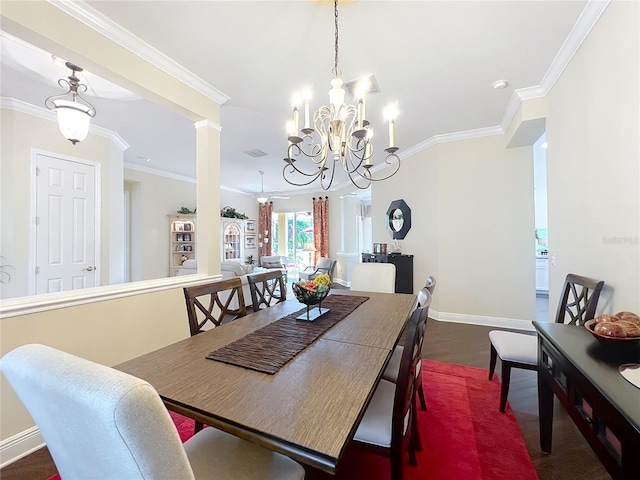 dining area with crown molding, dark wood-type flooring, and a notable chandelier