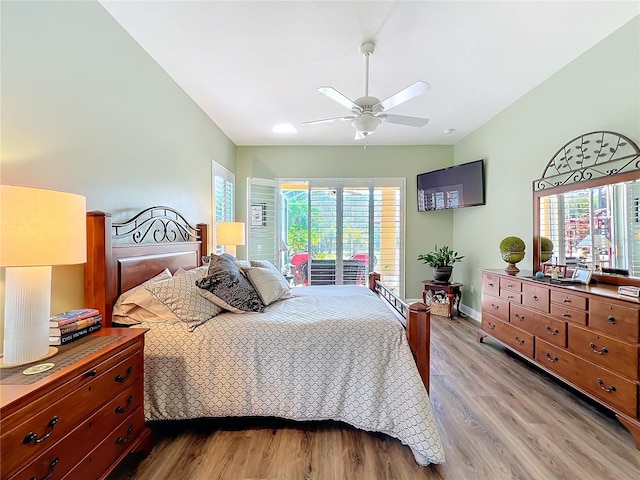 bedroom with ceiling fan, vaulted ceiling, light hardwood / wood-style flooring, and access to outside