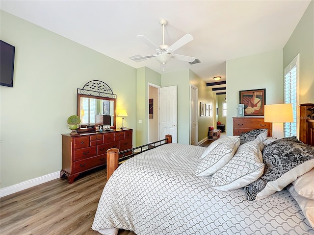 bedroom with wood-type flooring and ceiling fan