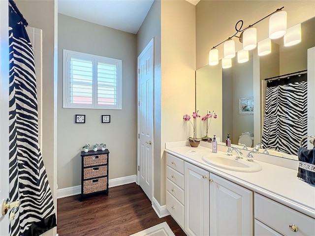 bathroom featuring vanity and hardwood / wood-style flooring