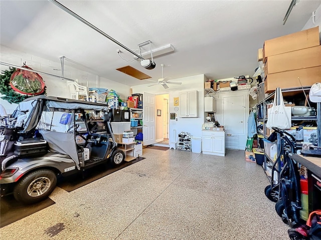 garage with a garage door opener and ceiling fan