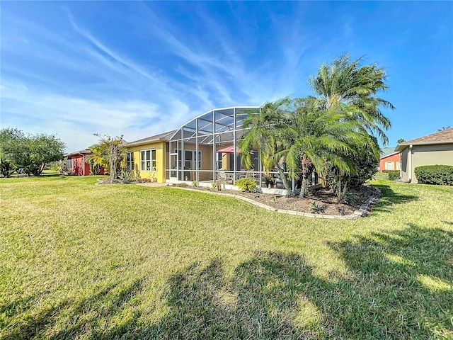 view of yard with glass enclosure