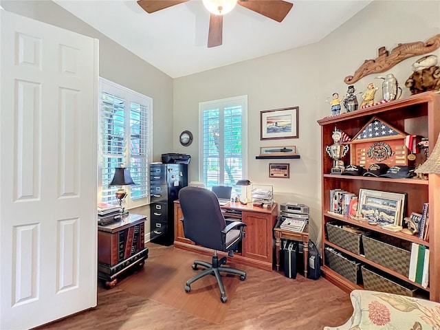 home office featuring hardwood / wood-style flooring, plenty of natural light, and ceiling fan